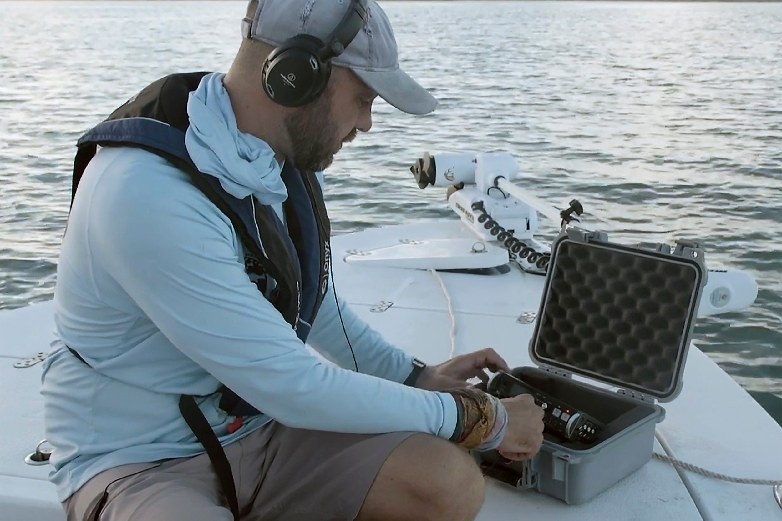 Chris Biggs, a graduate student at the University of Texas at Austin, listens to the sounds of fervid sea trout