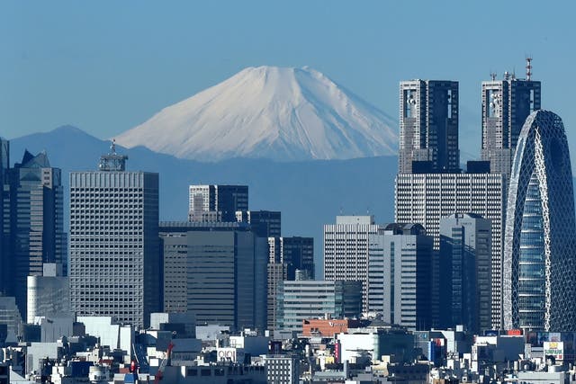 The Shinjuku commercial district in Tokyo: higher-skilled workers are to be offered renewable visas, under new proposals