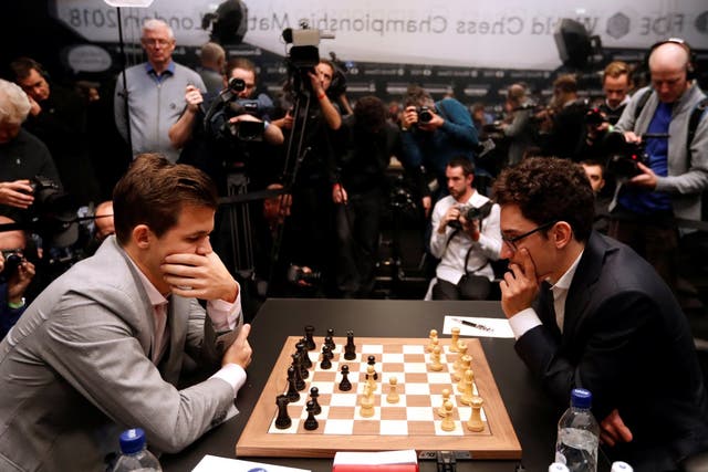 Behind unidirectional glass, Magnus Carlsen & Fabiano Caruana do battle at  the World Chess Championship, The Independent