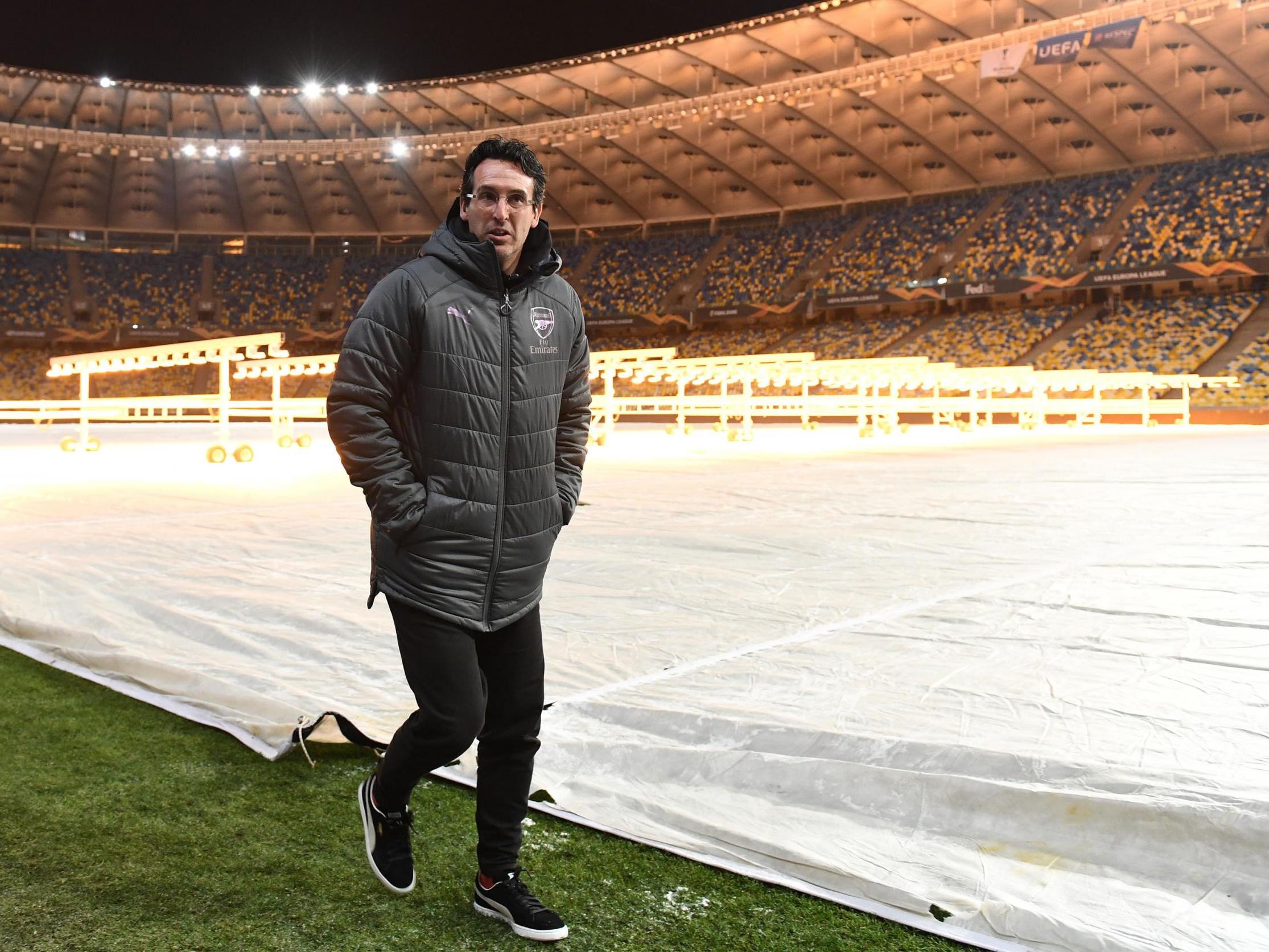 The Arsenal boss inspects the pitch at Kiev’s Olympic Stadium