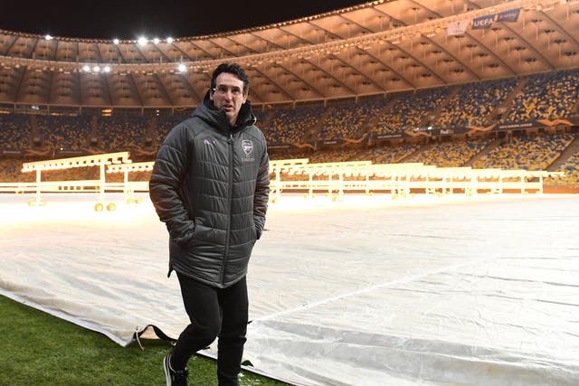 The Arsenal boss inspects the pitch at Kiev’s Olympic Stadium