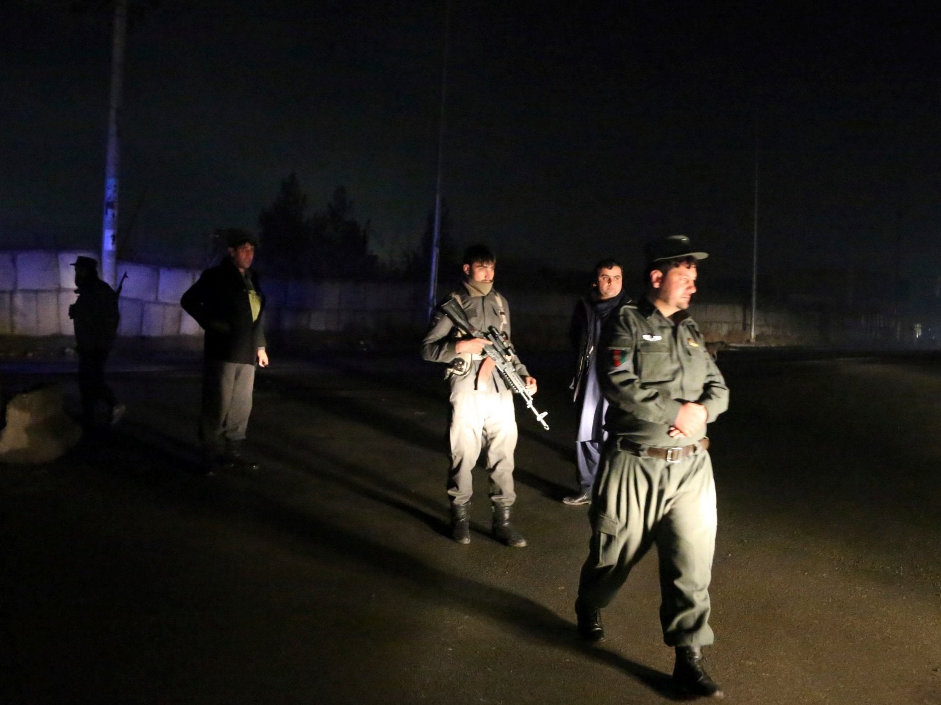 Security forces block the roads at the site of a suicide bomb attack in Kabul, Afghanistan