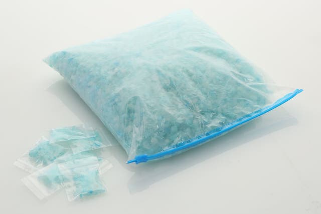 Officers found a blue, crystal-like substance, which a roadside test kit seemed to confirm was meth (pictured: a bag of 'blue sky' crystal meth used as a prop in US television series Breaking Bad /