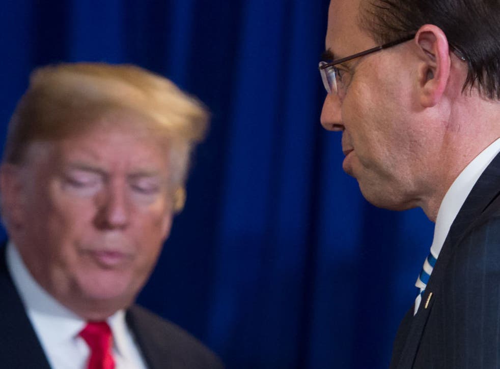 Donald Trump stands alongside Rod Rosenstein during immigration meeting in May