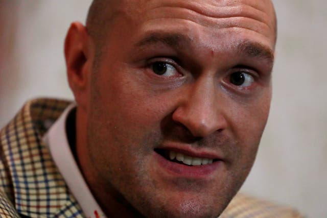A clean-shaven Tyson Fury called for Friday's face-off to be cancelled