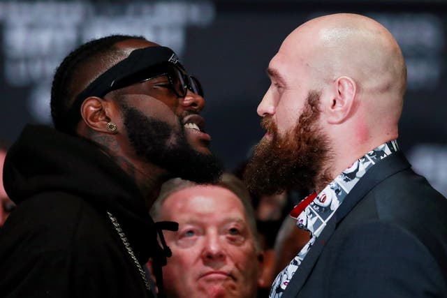 Deontay Wilder and Tyson Fury square up during the press conference
