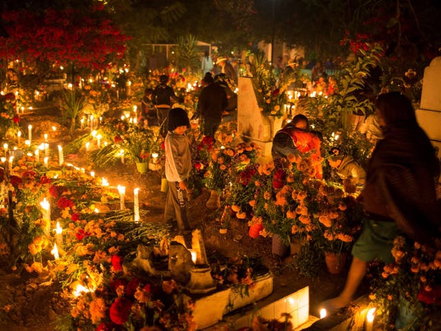 Mexicans visit the graves of their loved ones and set little altars in their honour on the Day of the Dead