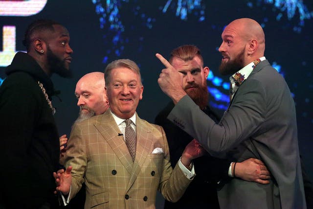 Tyson Fury squares up to Deontay Wilder at their final press conference