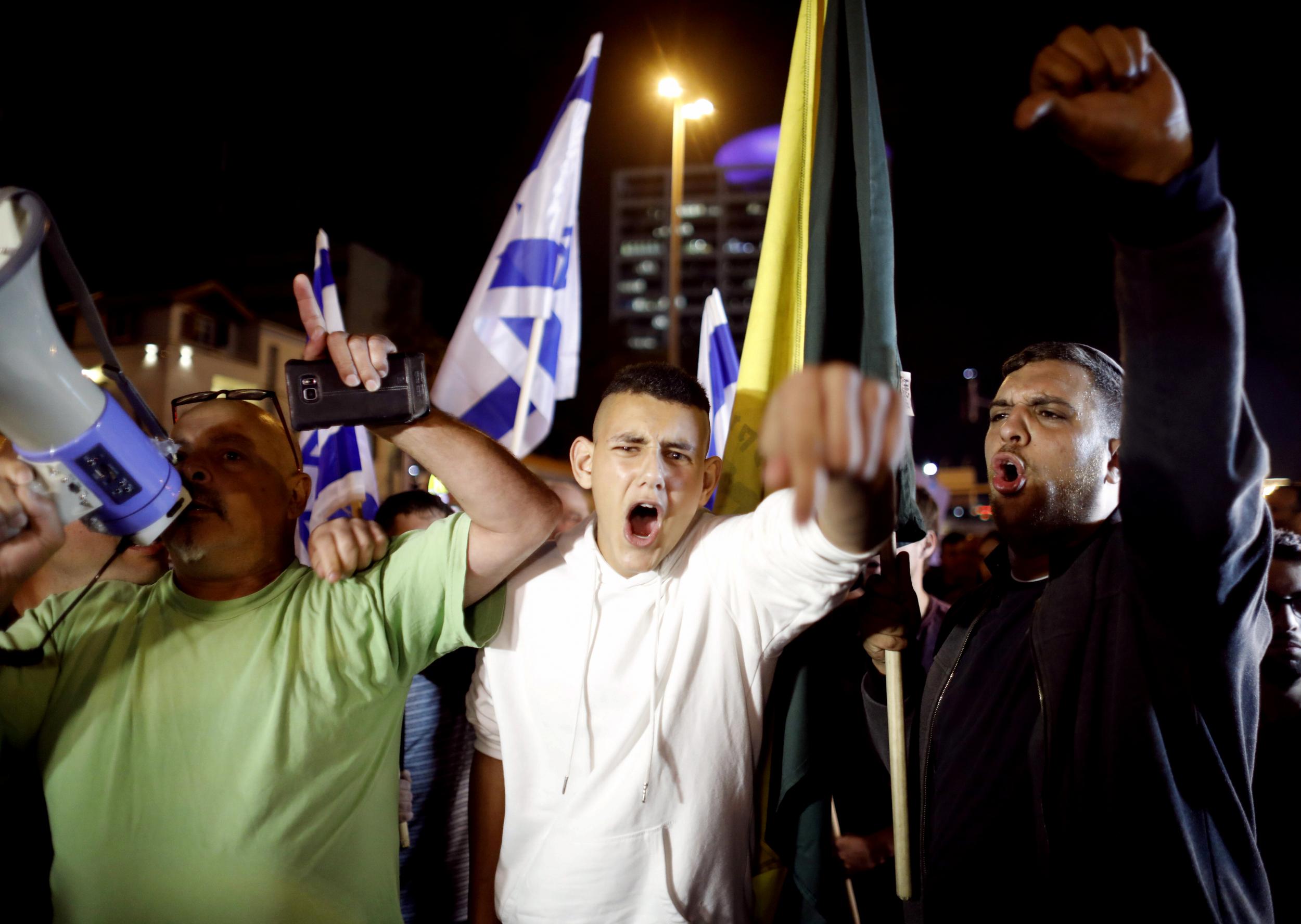 Residents of southern Israel protest in Tel Aviv against the ceasefire with Gaza (Reuters)