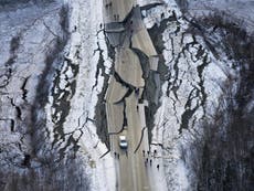Roads smashed to pieces and power to thousands cut by Alaska tremors