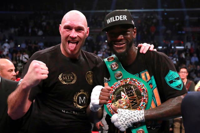 Deontay Wilder and Tyson Fury after the fight