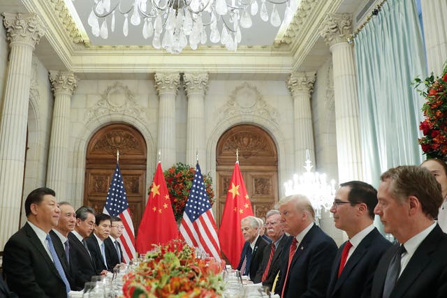 Donald Trump, China's President Xi Jinping and members of their delegations during their meeting