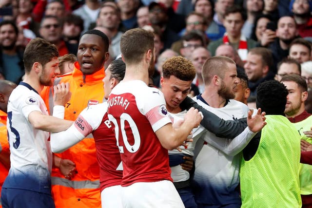Arsenal and Tottenham players come to blows