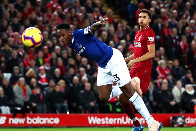 Everton's Yerry Mina defends a Liverpool cross in the box