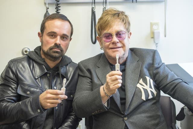 Sir Elton John and Evgeny Lebedev using simple mouth swab tests