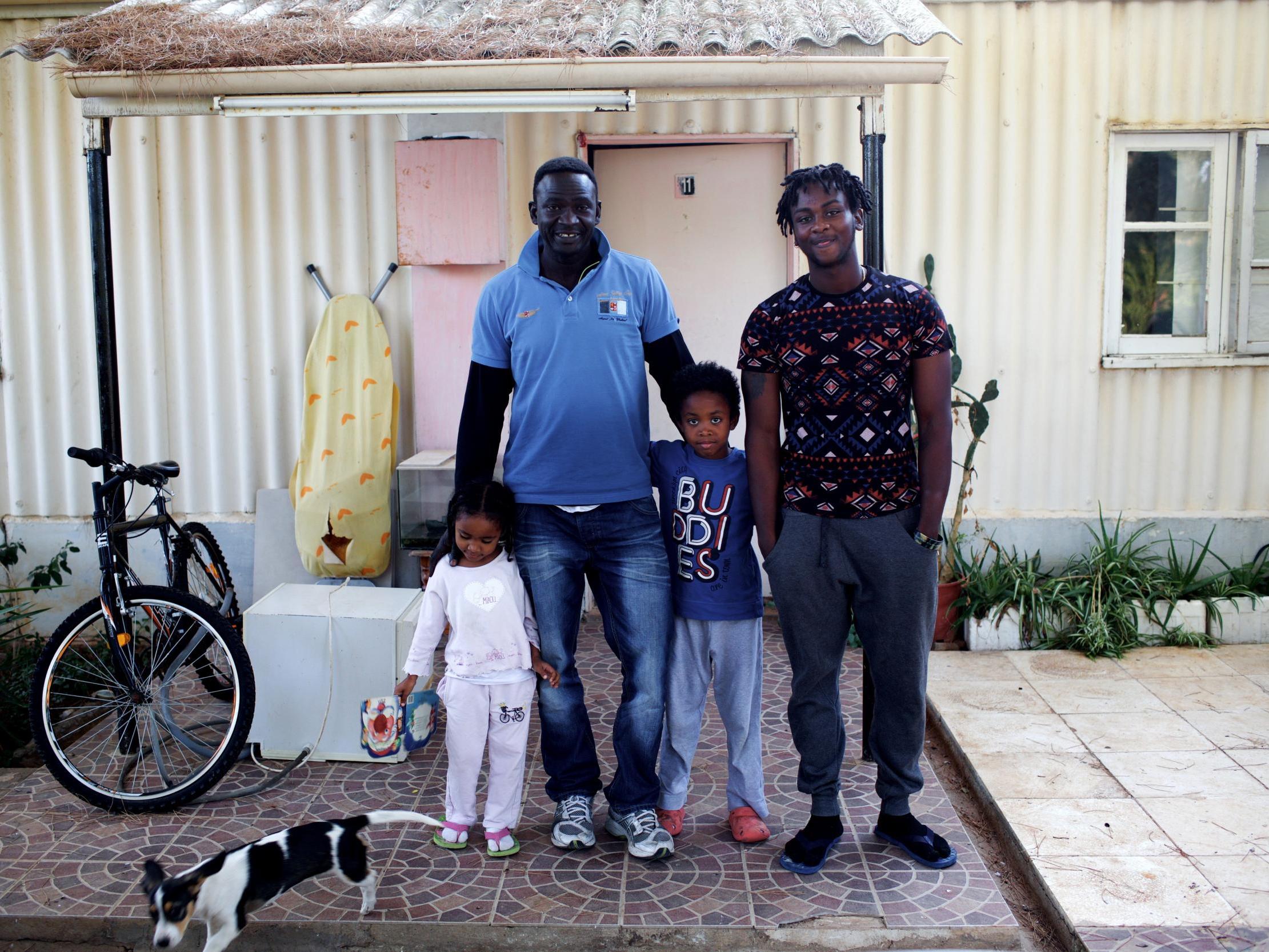 Sudanese refugee Taj Bashir, 43, with his children at the UK's Dhekelia military base, where he has lived for 20 years