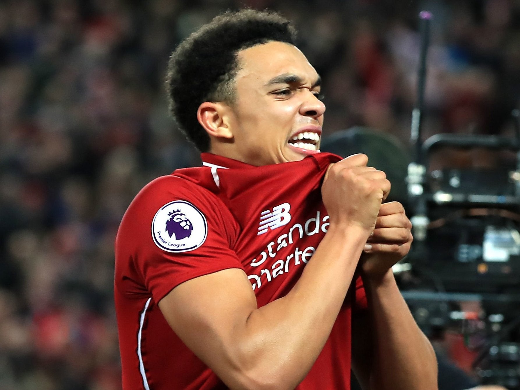 Trent Alexander-Arnold celebrates Liverpool's 1-0 victory in front of the Everton fans