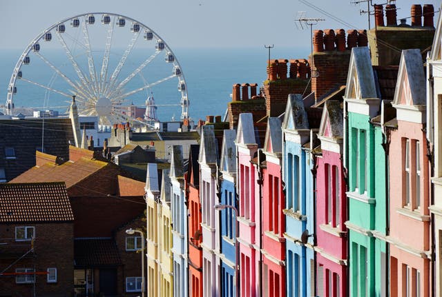 <p>Brighton draws streams of visitors, whatever the weather </p>