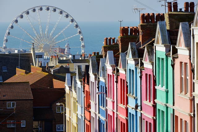 <p>Brighton draws streams of visitors, whatever the weather </p>