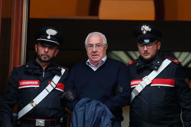 Settimino Mineo is escorted by Italian Carabinieri police after an anti Mafia operation