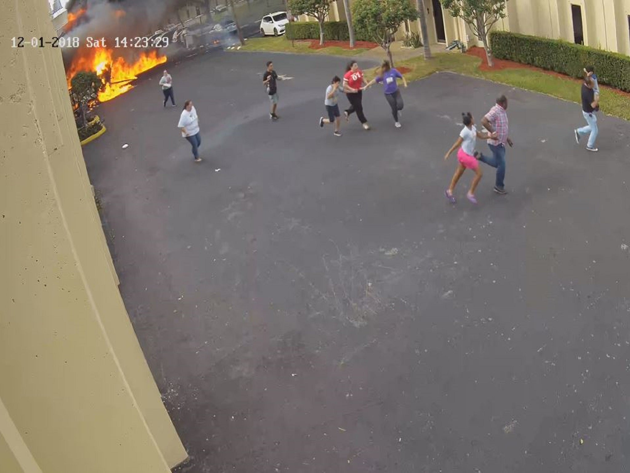 Children and teachers were forced to flee an autism therapy centre in Fort Lauderdale, Florida, after a plane crashed into a warehouse building on December 1, 2018. The pilot and his passenger were killed in the crash. (H & J Electronics International Inc)