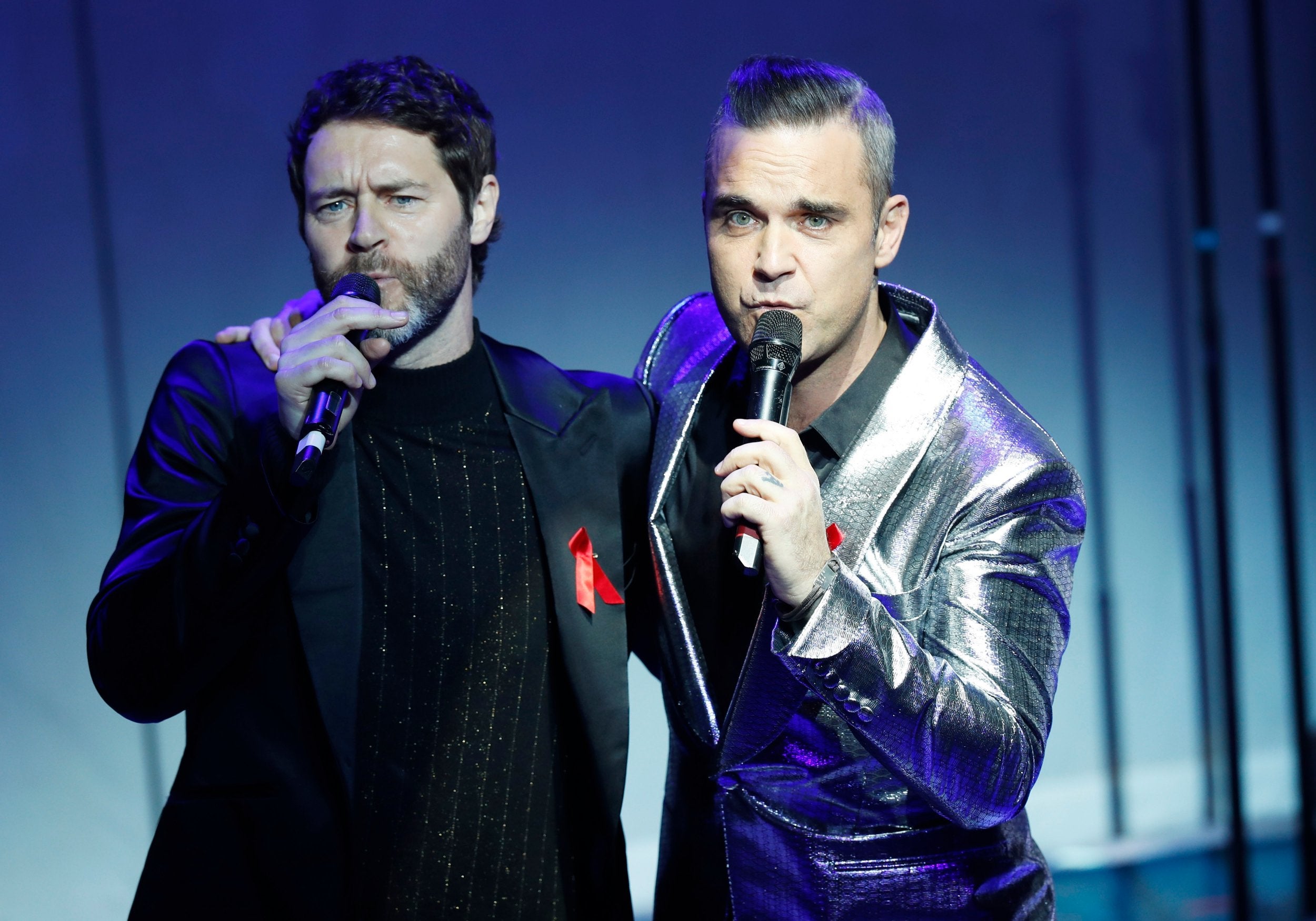 Howard Donald and Robbie Williams performing on Tuesday