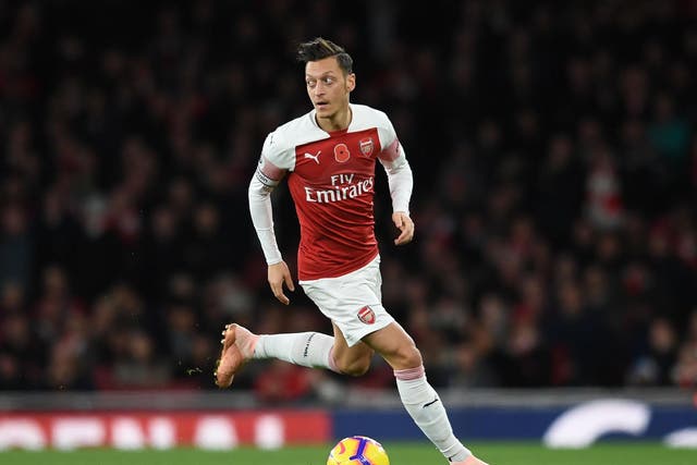 Ian Wright believes that Mesut Ozil isn't justifying his expensive wages at Arsenal