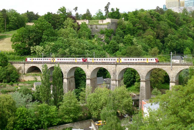 <p>A train crosses a viaduct in Luxembourg City</p>