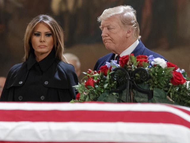 Donald Trump and wife Melania visit George HW Bush's casket in Washington on 3 December