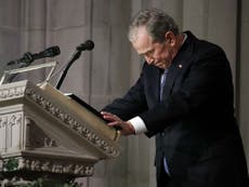 George HW Bush given emotional sendoff by son at funeral