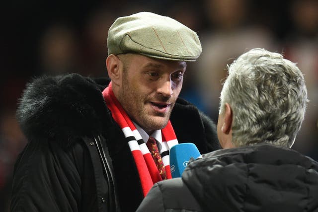 Tyson Fury was interview at pitchside at half-time