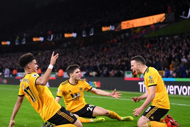 Diogo Jota, right, celebrates scoring Wolves’ winner