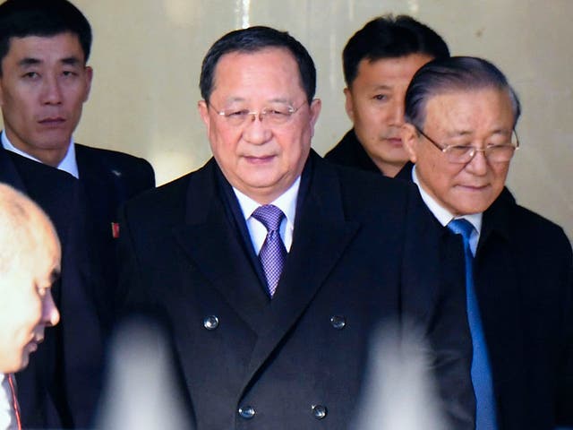 North Korean foreign minister Ri Yong Ho, centre, arrives at Beijing International airport on Thursday