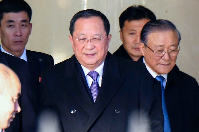 North Korean foreign minister Ri Yong Ho, centre, arrives at Beijing International airport on Thursday