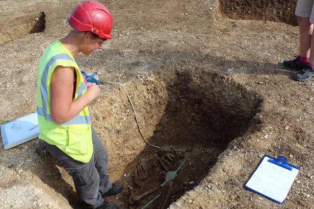 The excavation of the remains of a speared Iron Age man near Pocklington, Yorkshire