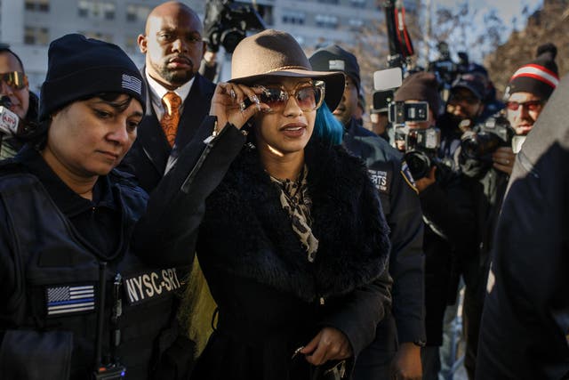 Rapper Cardi B, center, arrives at Queens County Criminal Court, Friday, 7 December 2018, in New York