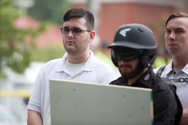 FJames Alex Fields Jr., (L) is seen attending the "Unite the Right" rally in Emancipation Park before being arrested by police in Charlottesville, Virginia