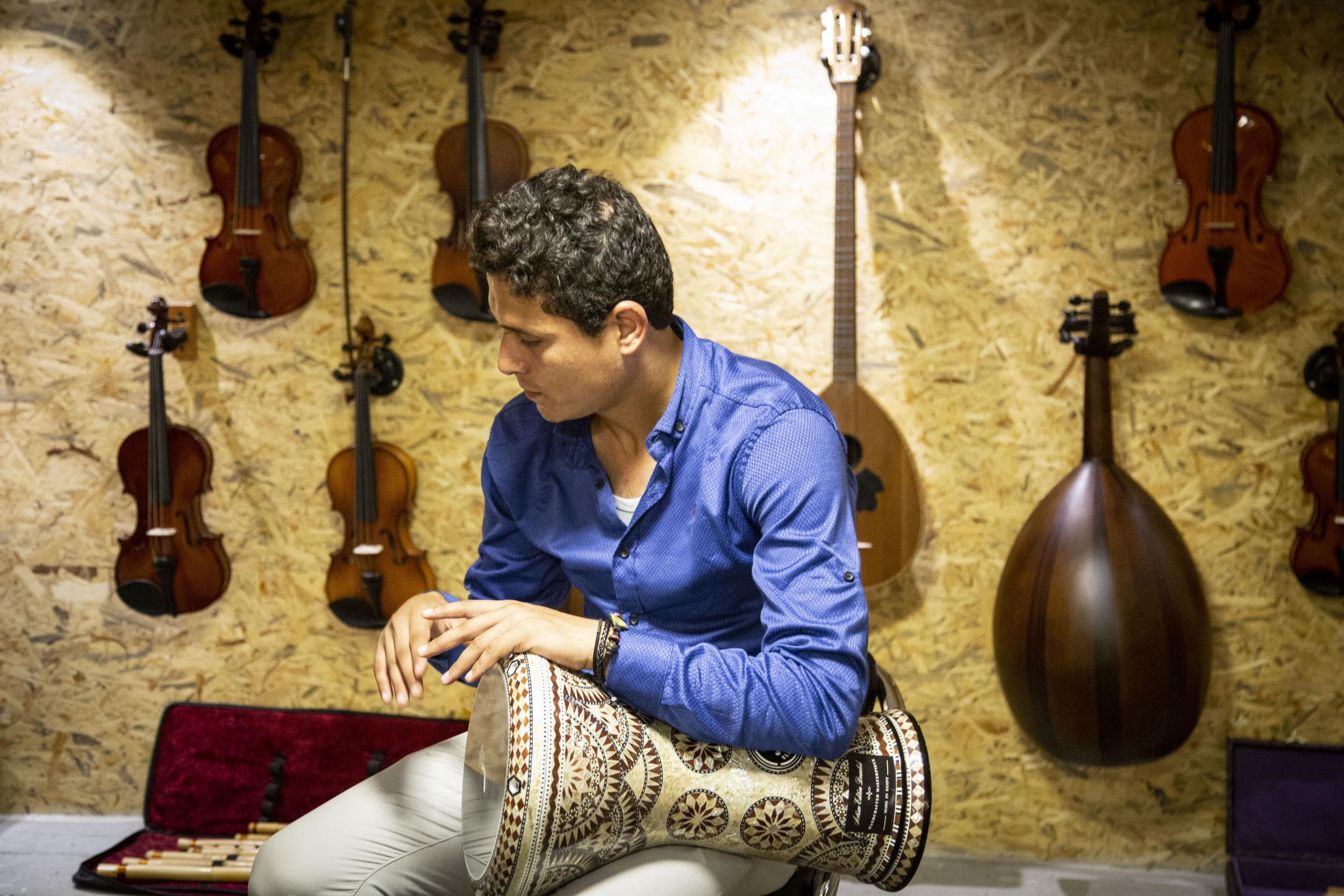 Mohamed plays a Tabla in Gaza’s first music shop