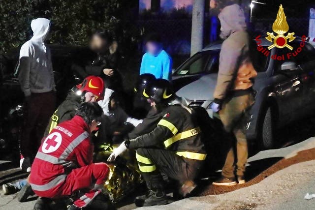 Italian fire and rescue service treating victims after a stampede at a nightclub in Cornaldo
