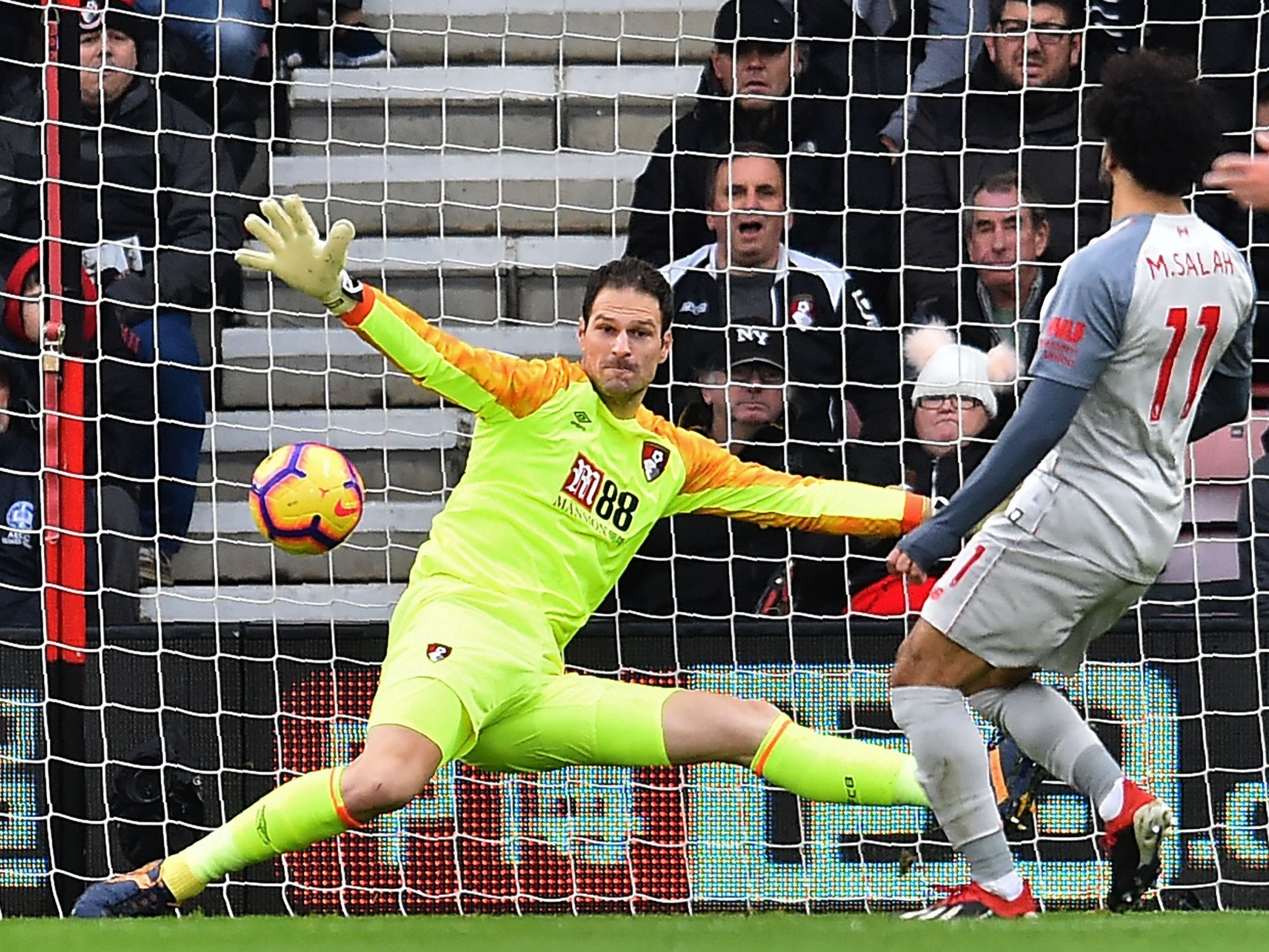 Mohamed Salah slots the ball past Asmir Begovic to put Liverpool ahead against Bournemouth