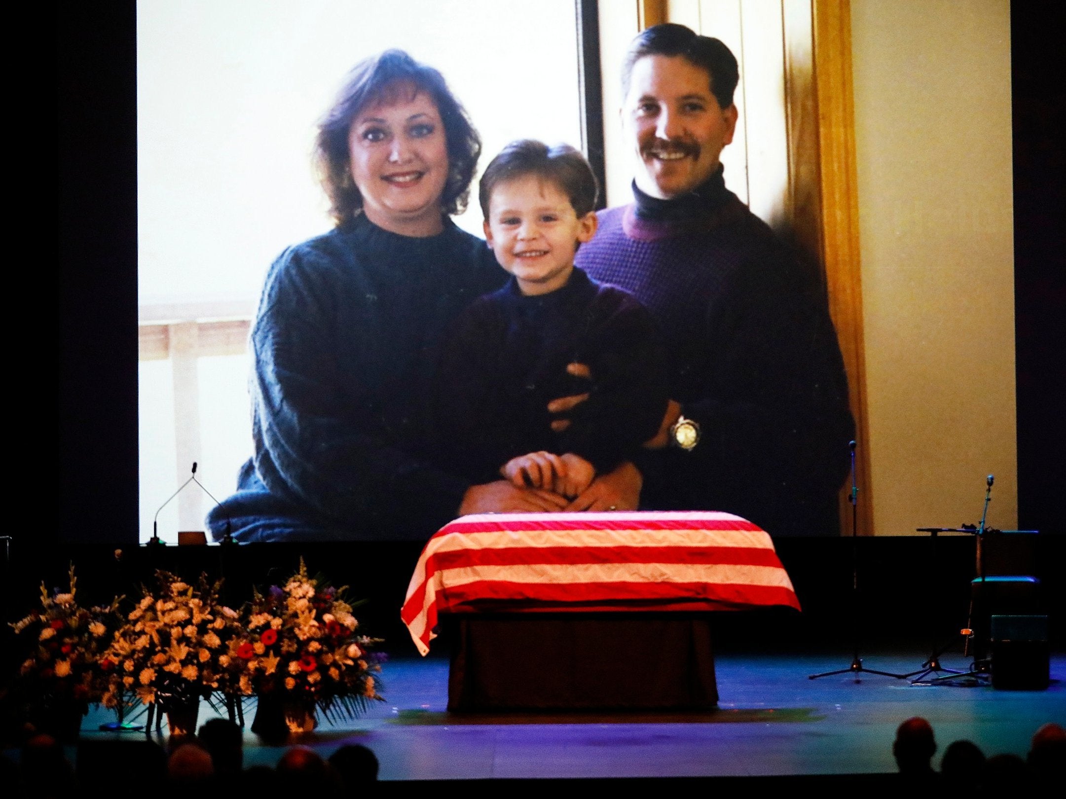 A family photo shown during a video montage of Ventura County Sheriff Sgt. Ron Helus with his wife Karen and son Jordan years ago. Sgt. Helus was one of twelve victims of the Borderline Bar &amp; Grill mass shooting in Thousand Oaks, California, on 7 November, 2018.