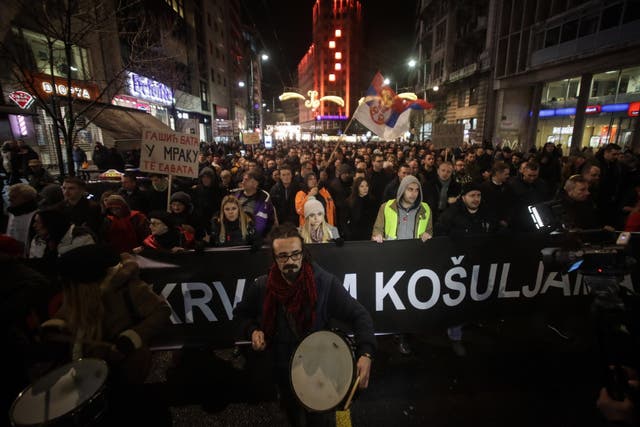 Demonstrators take part in a protest against violence on 8 December, 2018 in Belgrade.