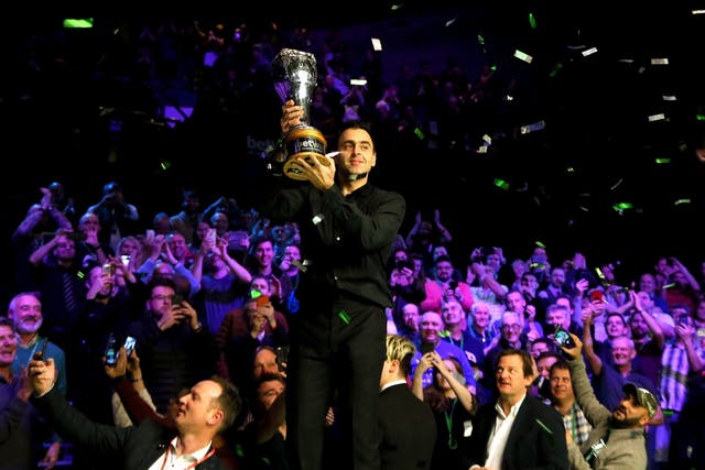 Ronnie O’Sullivan holds up the trophy at the York Barbican