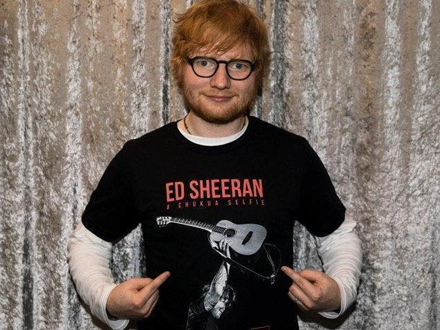 Ed Sheeran wearing his T-shirt which is being sold for The Independent's Christmas appeal