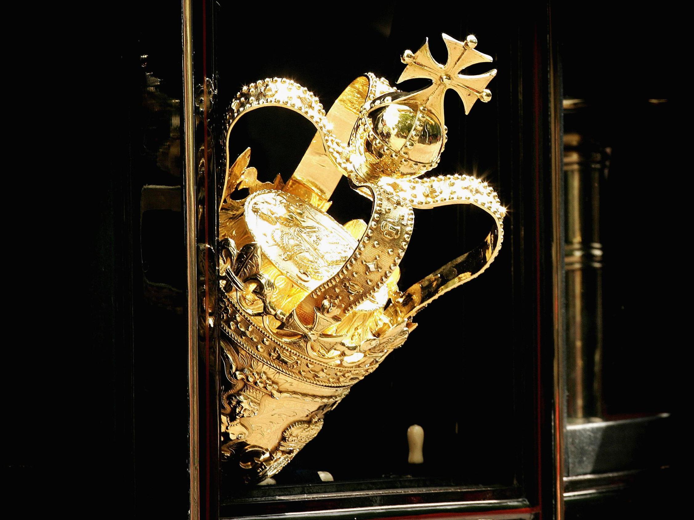 The ceremonial mace protruding from a carriage window as it travels to Parliament