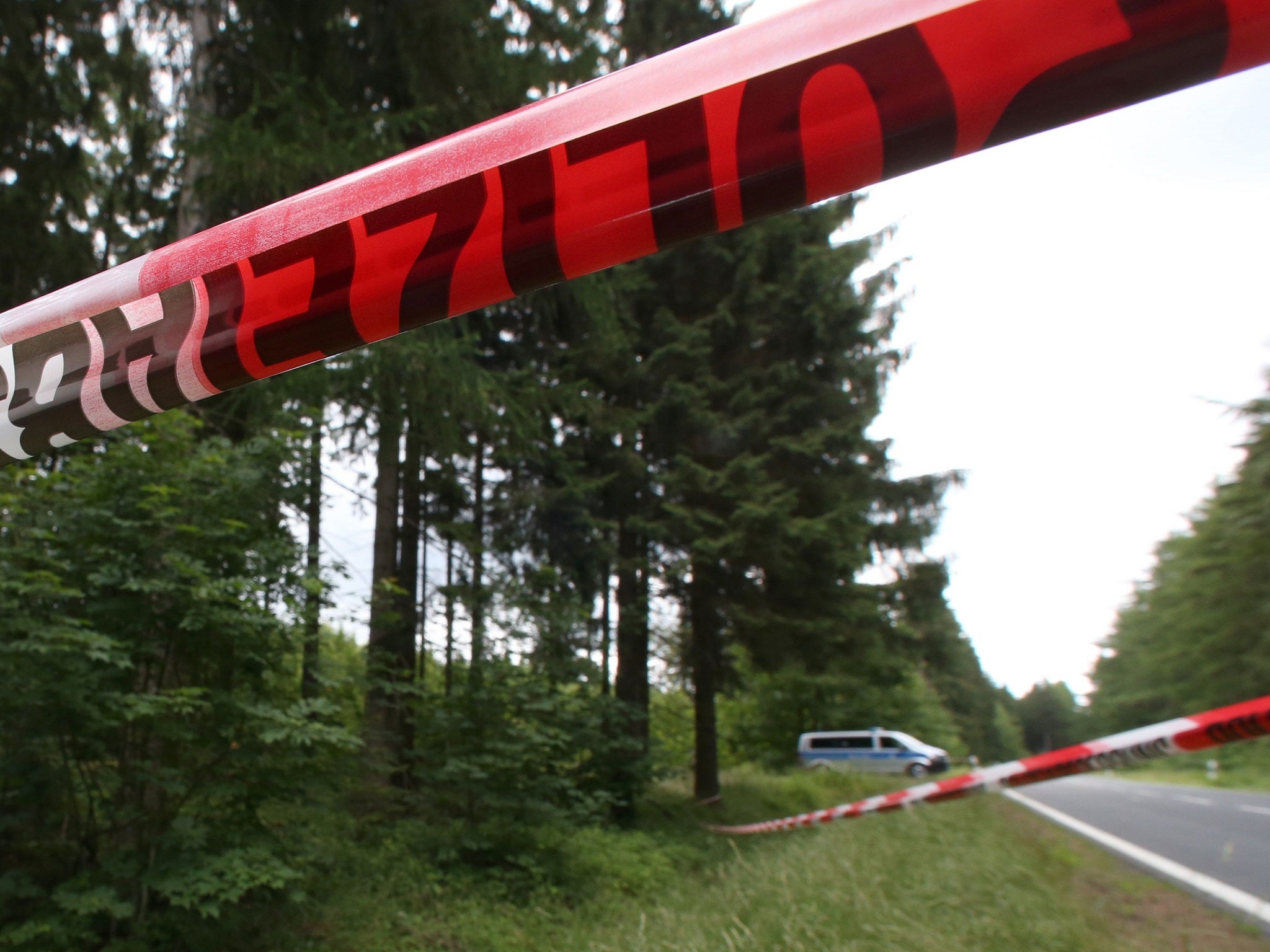 Picture taken on 6 July, 2016 shows a police cordon at a forest near Rodacherbrunn, eastern Germany, where remains of alleged murder victim Peggy Knobloch were found.