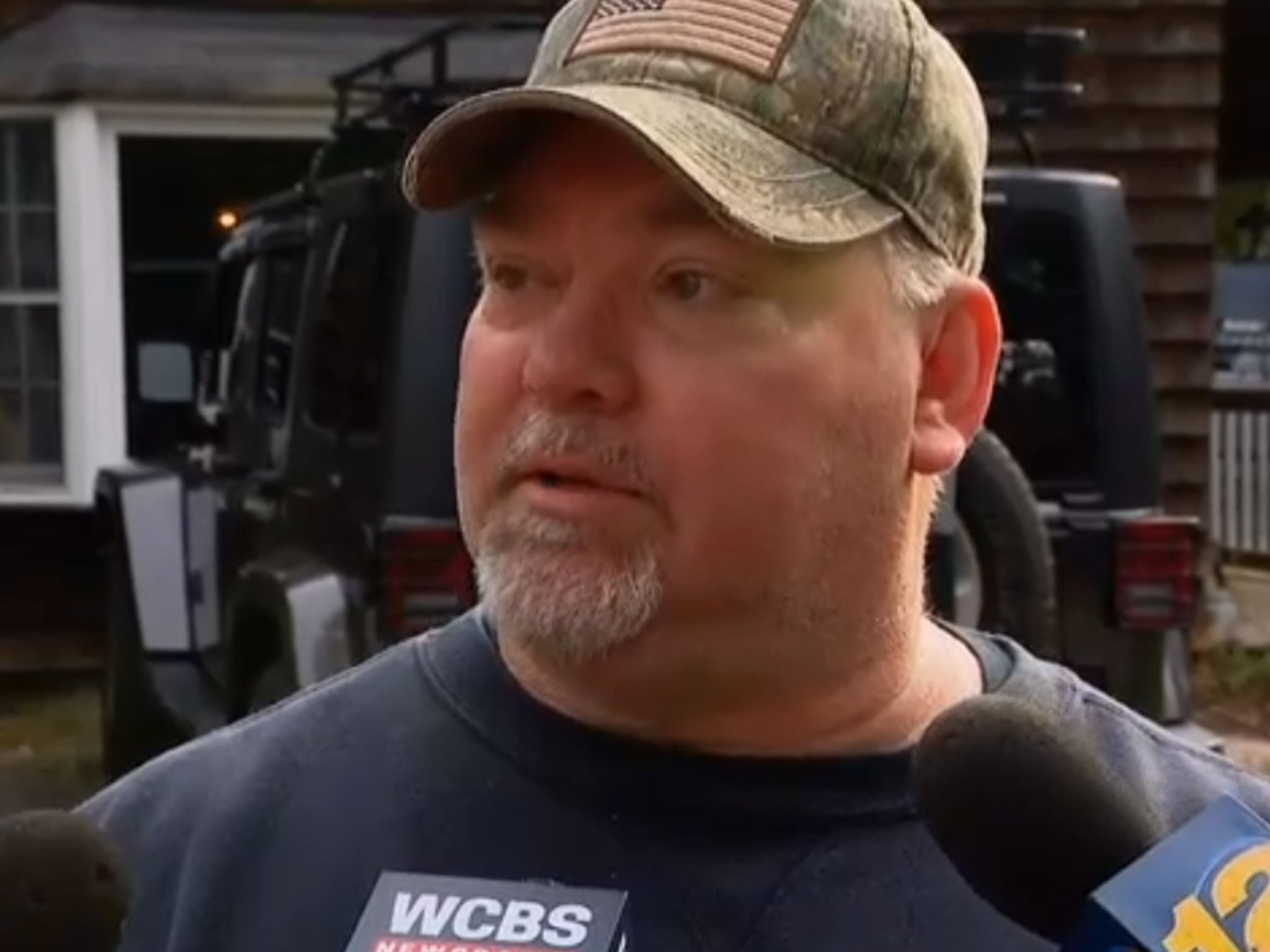 Michael Carroll speaking to reporters outside his home once the DNA match had been made