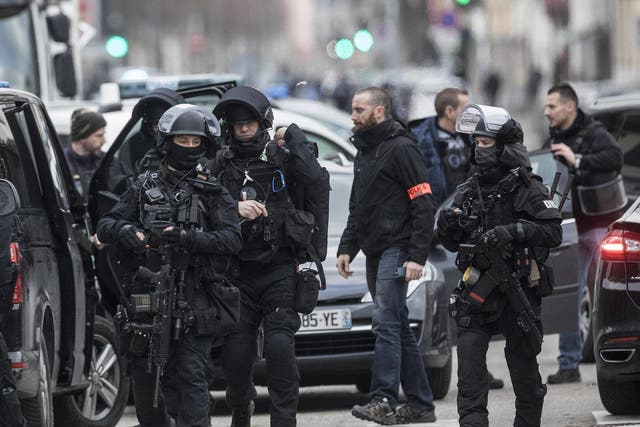 Armed police officers take position in the Neudorf district of Strasbourg, eastern France