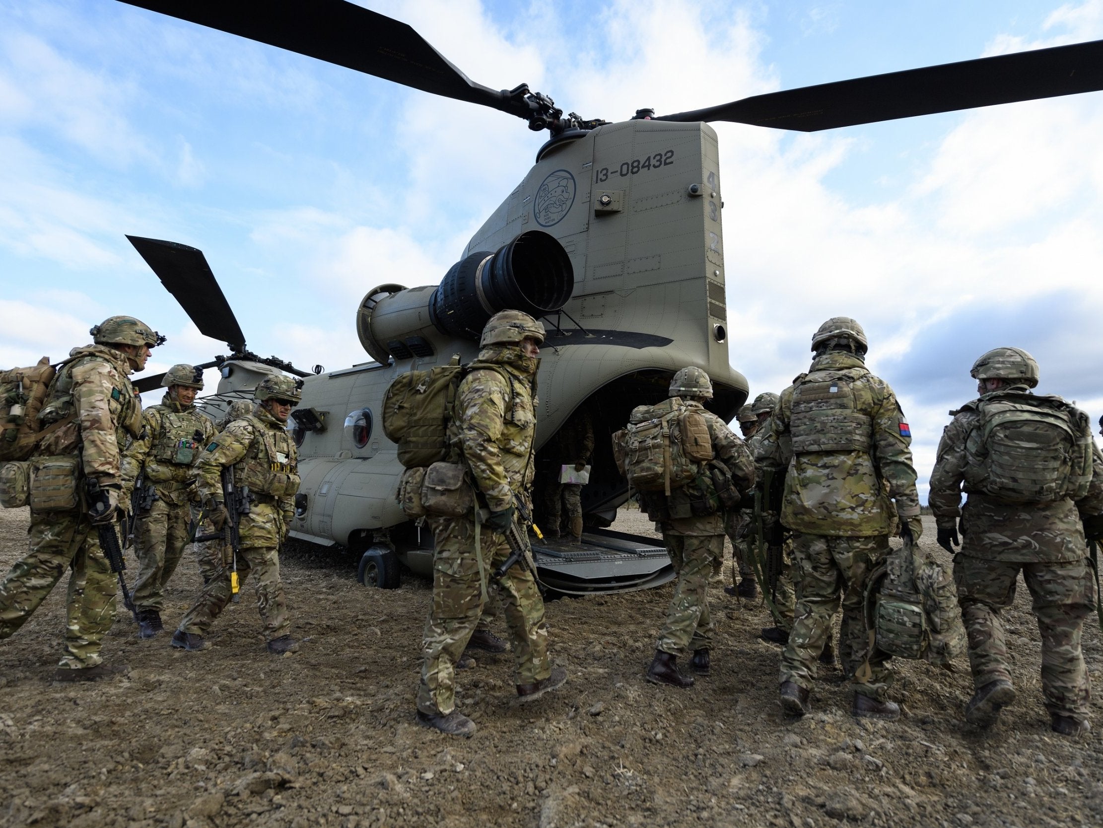 Members of the British Army Royal Irish Battle Group prepare to board a US Army Chinook helicopter during an exercise in Haslemoen, Norway, October 2018