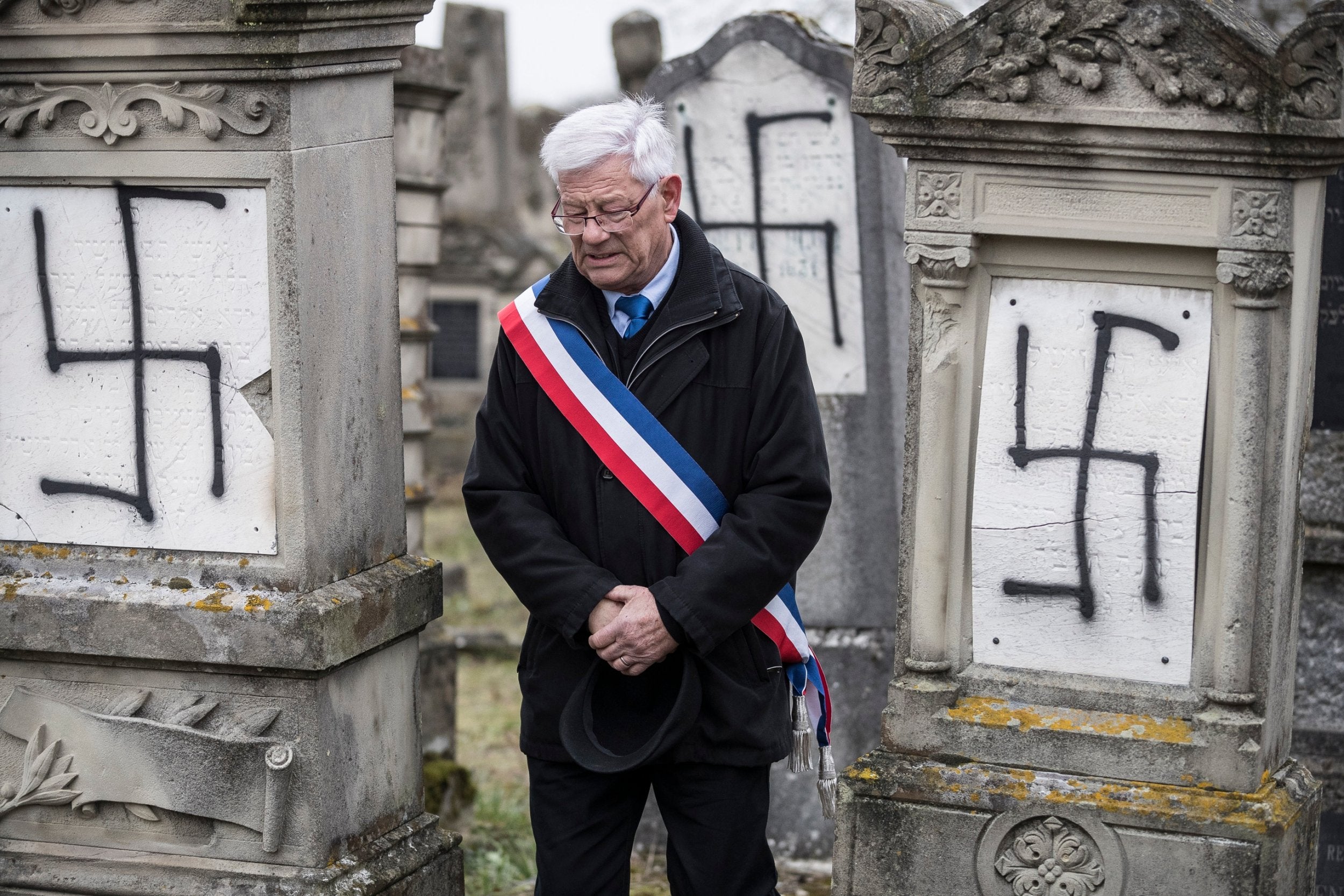 Local deputy mayor Jacques Kistler attends a ceremony to denounce the vandalism